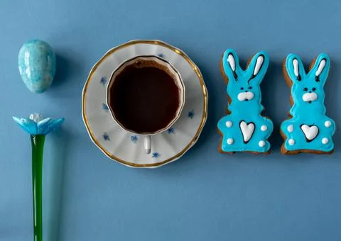 Blue easter bunny gingerbread cookie with a cup of coffee Stock Photos