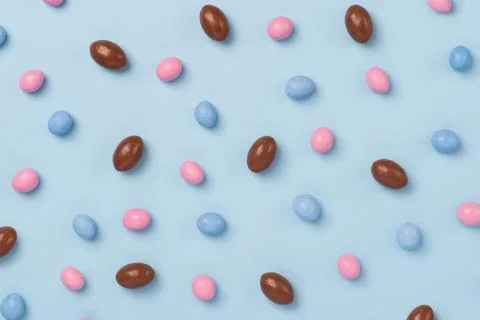 Blue easter dragee on a blue background Stock Photos