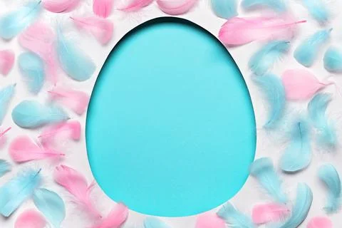 Blue easter Egg shaped hole with copy space. Creative layout with colored Fotos Stock