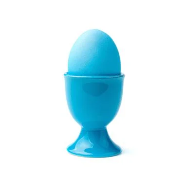 A blue Easter egg on a stand is isolated on a white background. Stock Photos