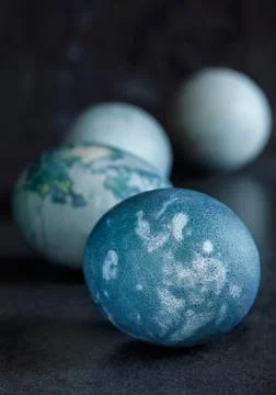 Blue easter eggs on a dark background Stock Photos