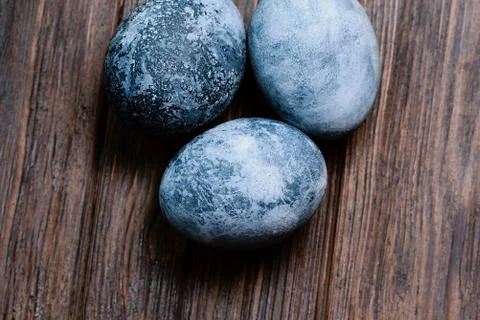 Blue Easter eggs on rustic table wood. Naturally Eggs painted with hibiscus w Stock Photos