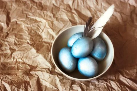 Blue easter eggs in a white plate. rustic style. Stock Photos