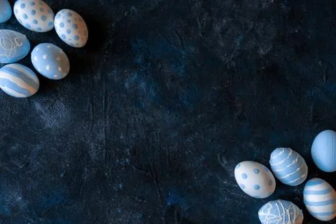 Blue eggs on black background Stock Photos