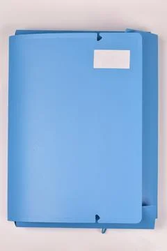 Blue elasticated folder for documents and office organization Stock Photos