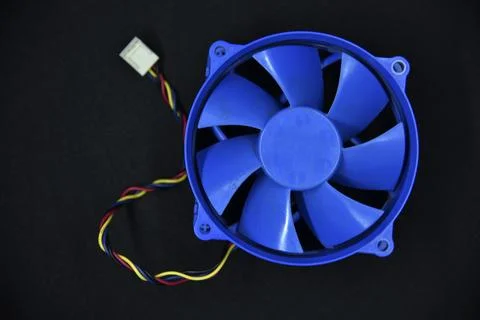 Blue electric fan for cooling the computer processor. Computer fan. Stock Photos