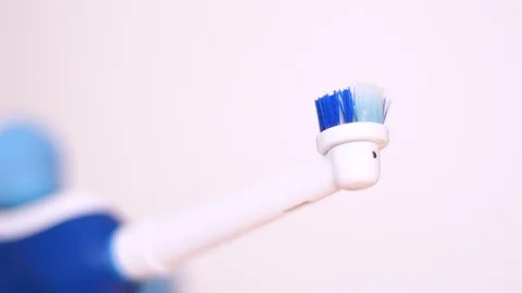 Blue electronic toothbrush closeup 動画素材 96985851