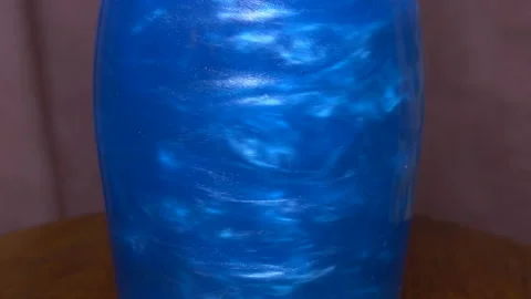 Blue elixir in a bottle clouseup Stock Footage 93902606