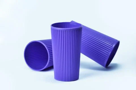 Blue empty plastic cup isolated on white Stock Photos