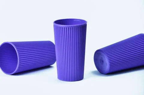 Blue empty plastic cup isolated on white Stock Photos