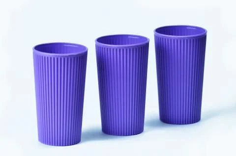 Blue empty plastic cup isolated on white Stock Photos