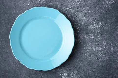 Blue empty plate on gray background Stock Photos