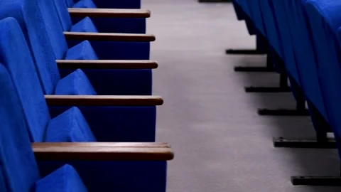 Blue empty seats in the audience prepared for the participants of the confe.. Видео 253085768