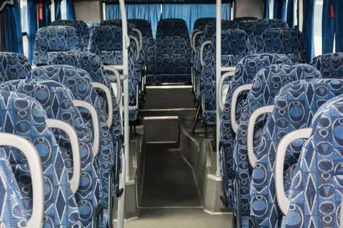 Blue empty seats in the bus Stock Photos