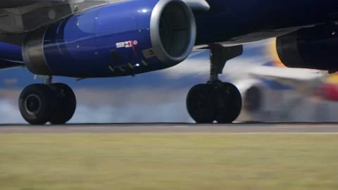 Blue engine jet touching down on the runway Stock Footage 337784956