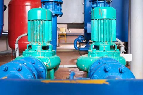 Blue engine with a pump connected to the blue pipes. Stock Photos