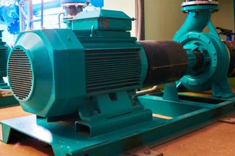 Blue engine with a pump standing on a metal stand. Stock Photos