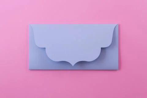 Blue envelope on a pink background. Stock Photos