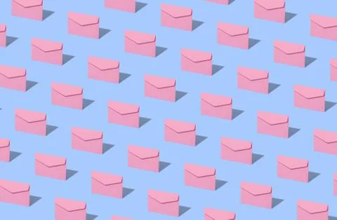 Blue envelope on a pink background. Stock Photos