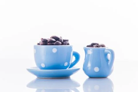 Blue espresso dishware with coffee beans Stock Photos