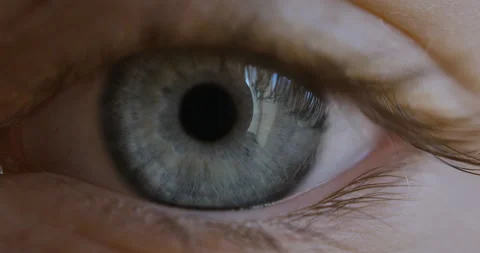 Blue Eye of Child Looking at Camera Close Up. Macro Shot Opening and Closing Stock Footage 141186074