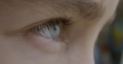 Blue Eye of Child Looking at Camera Close Up. Macro Shot Opening and Closing  Stock-Footage 142192544
