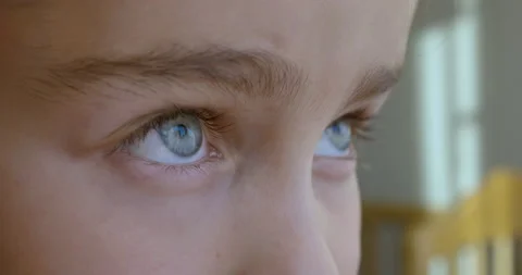 Blue Eye of Child Looking Up Close Up. Macro Shot Opening and Closing Blue Ey Stock-Footage 141184946