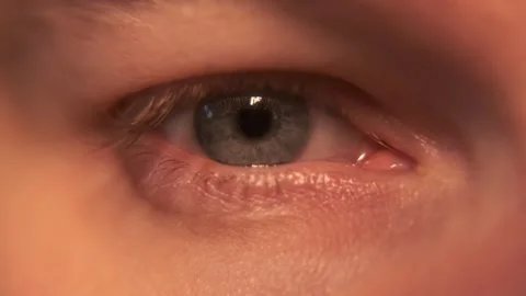 Blue eye wide open. Macro close-up. Blinks. Looks around. Stock Footage 304457280