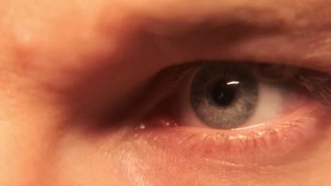 Blue eye wide open. Macro close-up. Blinks. Looks around. Stock Footage 304457338