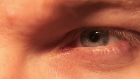 Blue eye wide open. Macro close-up. Blinks. Looks around. Stock Footage 304457340