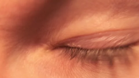 Blue eye wide open. Macro close-up. Blinks. Looks around. Stock Footage 304457357