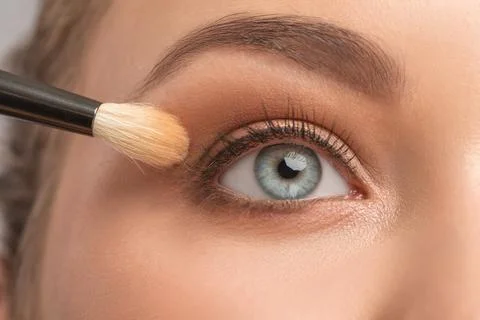 Blue eyes and eyebrows close-up. Portrait of a beautiful teenage girl with be Stock Photos