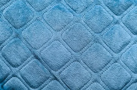 Blue fabric with a textured square pattern. background Stock Photos