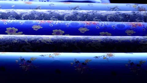Blue fabrics in large rolls Stock Photos