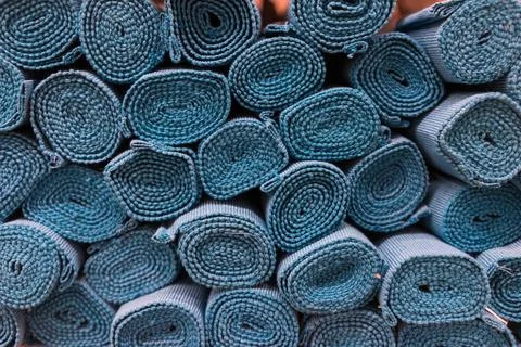 Blue fabrics rolls stack. Stock Photos