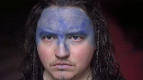 Blue Face Painted Man Determined Stare Video stock 81551208
