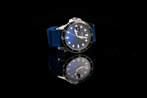 Blue face wrist watch with reflection Stock Photos