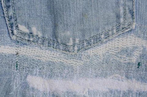 Blue faded ripped jeans ,close up Stock Photos