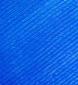Blue feather as a background. Stock Photos