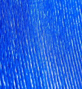 Blue feather as a background. Stock Photos