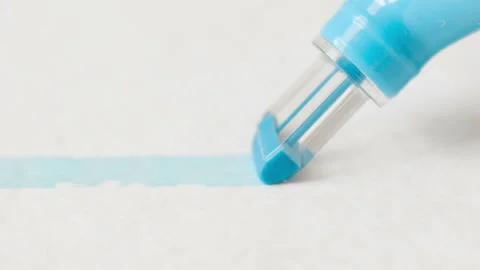 Blue felt-tip pen writes line on paper. Macro Stock-Footage 97780951