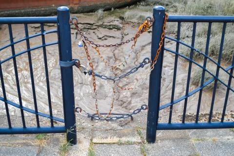 Blue Fence Posts Connected By Chains Stock Photos