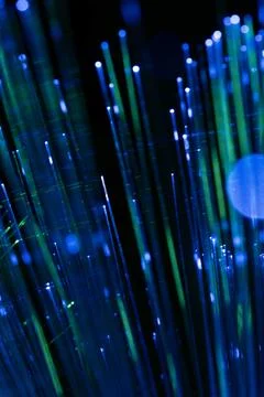 Blue Fiber Optic Cable Lines with Abstract Motion Blur Background Foto stock