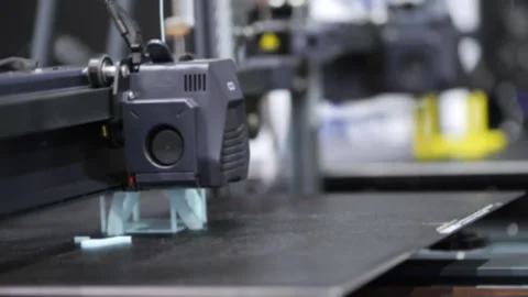 Blue filament is layered by 3D printer nozzle Stock Footage 345861191