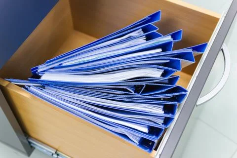 Blue file folder documents In a file cabinet retention of contracts. 스톡 사진