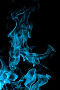 Blue fire on black background Stock Photos