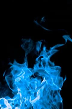 Blue fire on black background Stock Photos