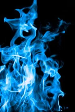 Blue fire on black background Stock Photos