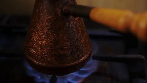 Blue fire burning under the copper pots on a gas stove. Stock Footage 129554754