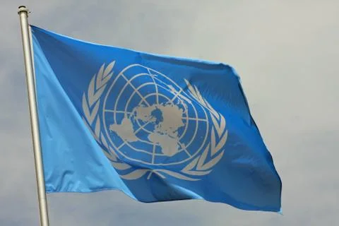 Blue flag of the un united nations organisation Stock Photos